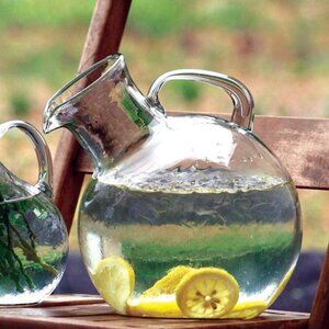 Small Mouthed Circular Tilted Pitcher